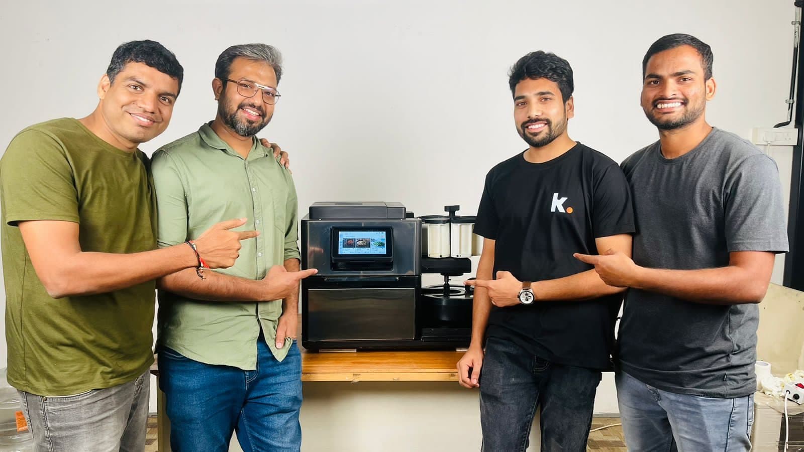 The KOMA build team with the machine